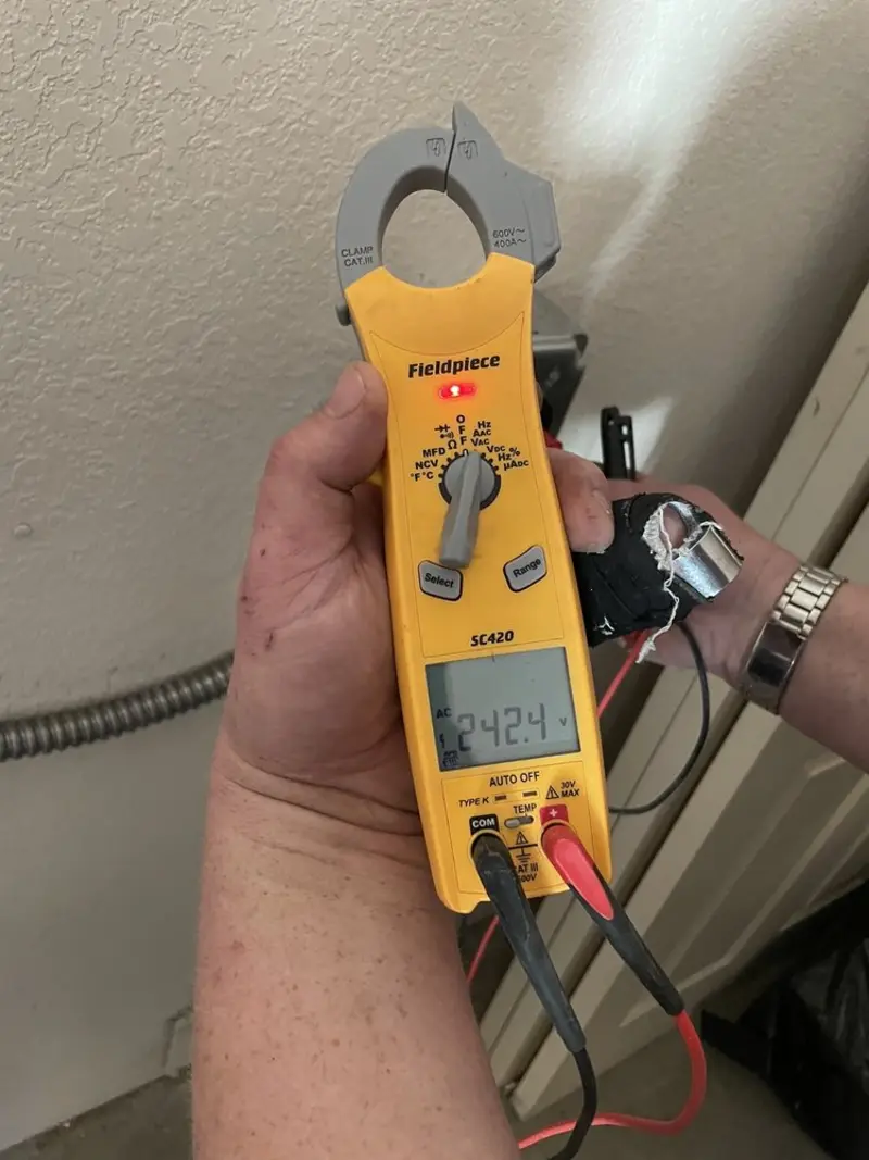 Voltage testing with clamp meter during Ceiling Fan Installation in Raynham